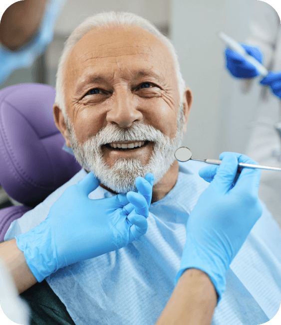 old man smiling at denturist