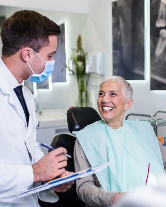 denture patient happy with doctor